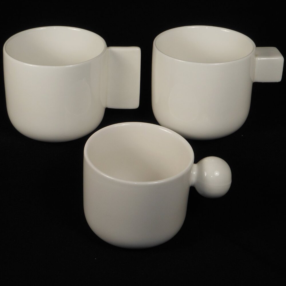 3  beautiful Coffee Mugs. oui white weight porcelain
